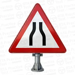 Road narrows on both sides